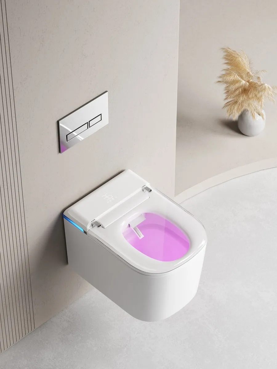 Wall-hung smart toilet with the inside of the bowl lit by violet light